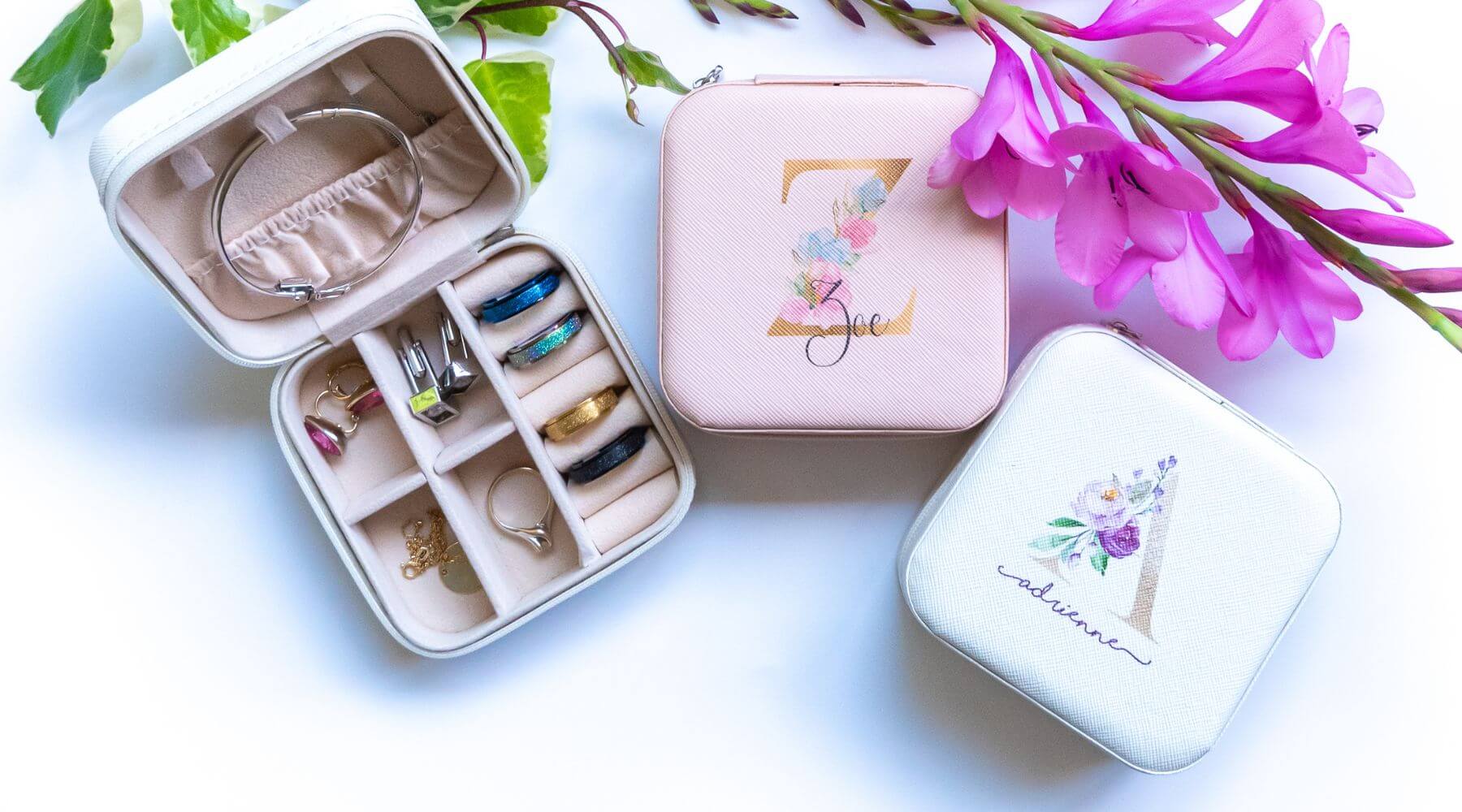 Personalised jewellery boxes next to pink flower