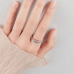 Cubic zirconia sliding beads ring for fidgeting on a woman's index finger
