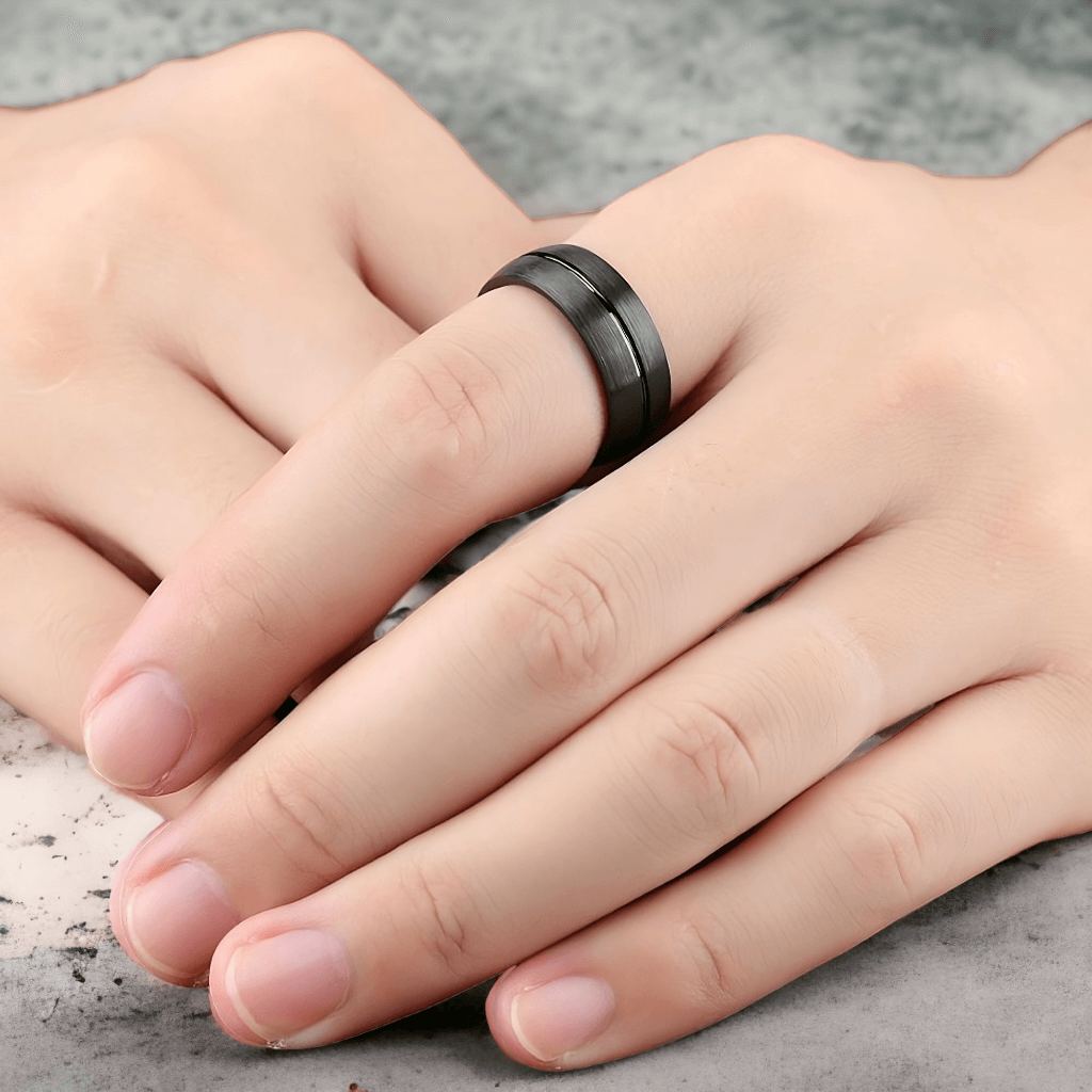 Black titanium ring on white background