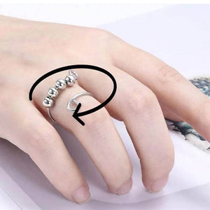 Sterling silver adjustable ring with 4 beads on woman's finger