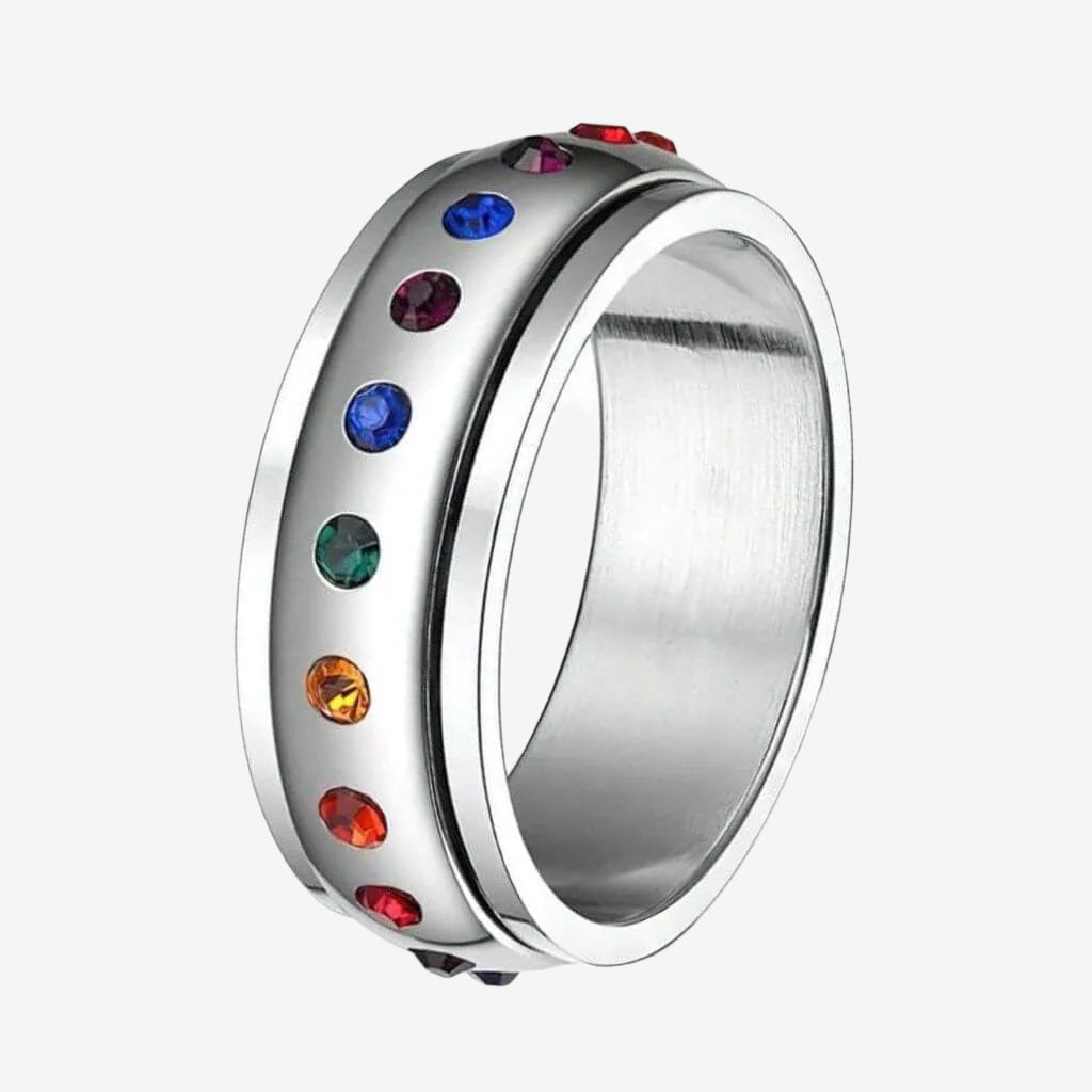 Band fidget ring with multi colored cubic zirconia on white background