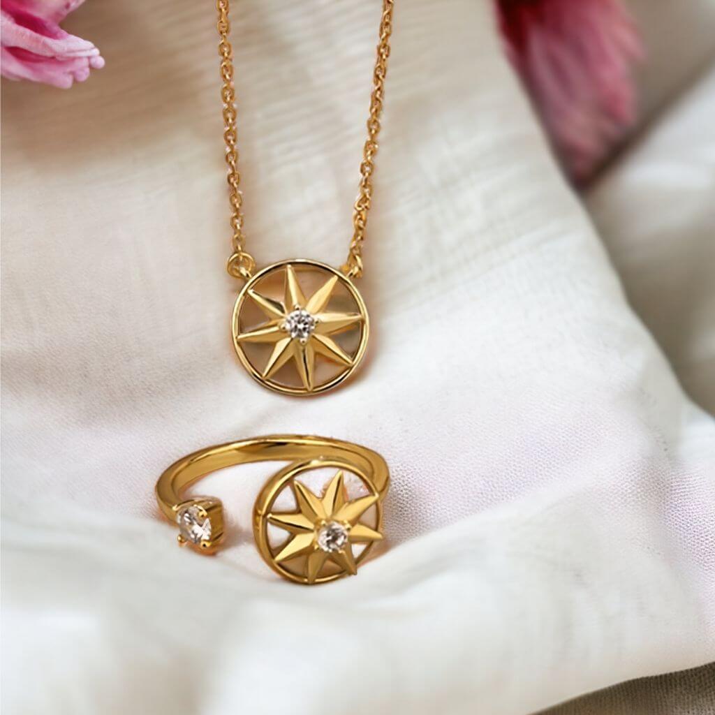 Fidget jewellery for adults sterling silver ring and necklace set with star spinning top on white fabric