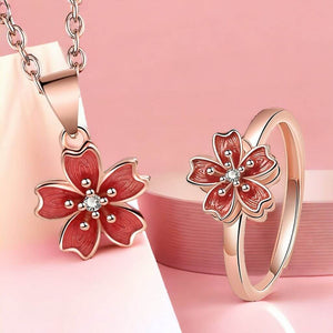 Fidget jewellery ring and necklace with flower top on pink background