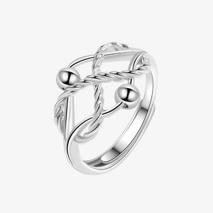 Fidget ring sterling silver with braided design and two beads on a white background