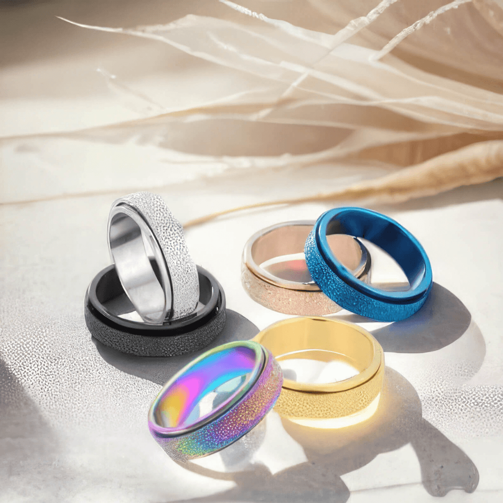 Set of colorful rings on a textured surface with a soft background