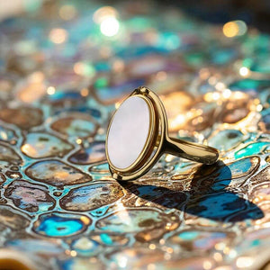 Gold shell rotating ring on a shiny surface