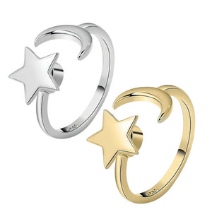 Moon and star rings in gold and silver on white background