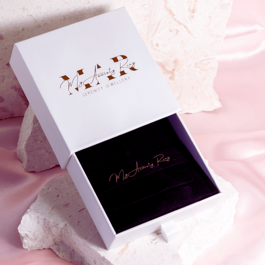 My Anxiety Ring white jewellery box on large stone prop