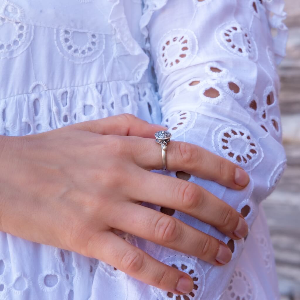 Resizable ring made of sterling silver after the buddhist tibetan prayer wheel on a woman's hand