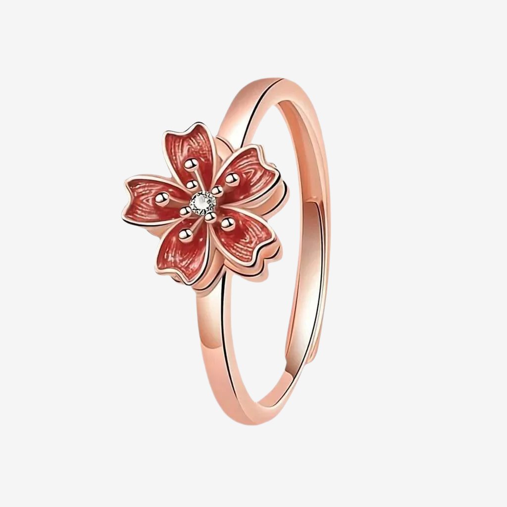 Ring for fidgeting with cherry blossom spinning top rose gold on white background