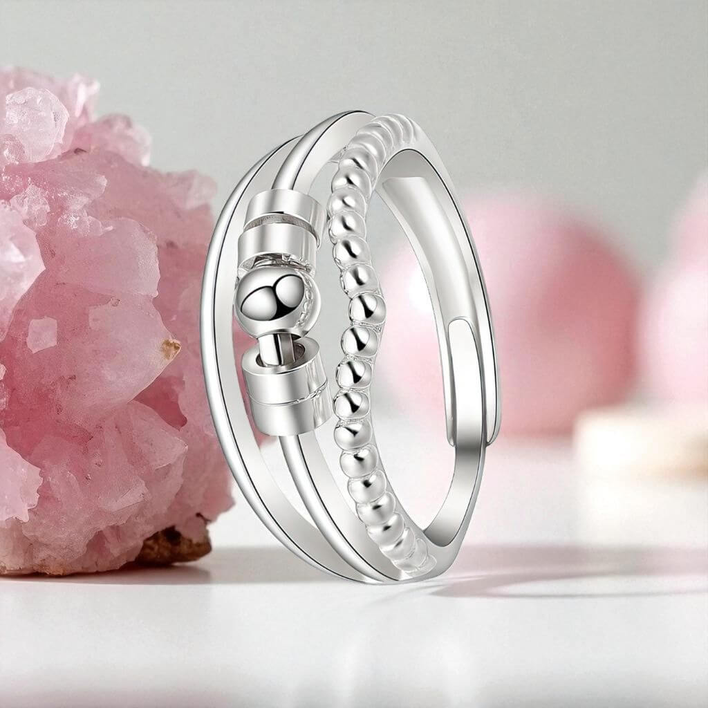Fidget ring for anxiety silver on a white background