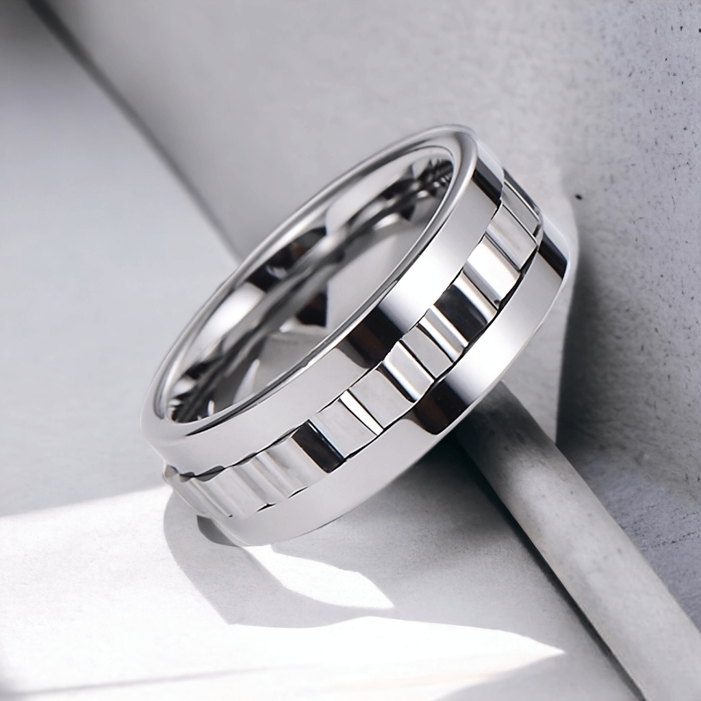 Silver tungsten gear ring that spins on white background