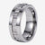 Silver tungsten gear ring that spins on white background