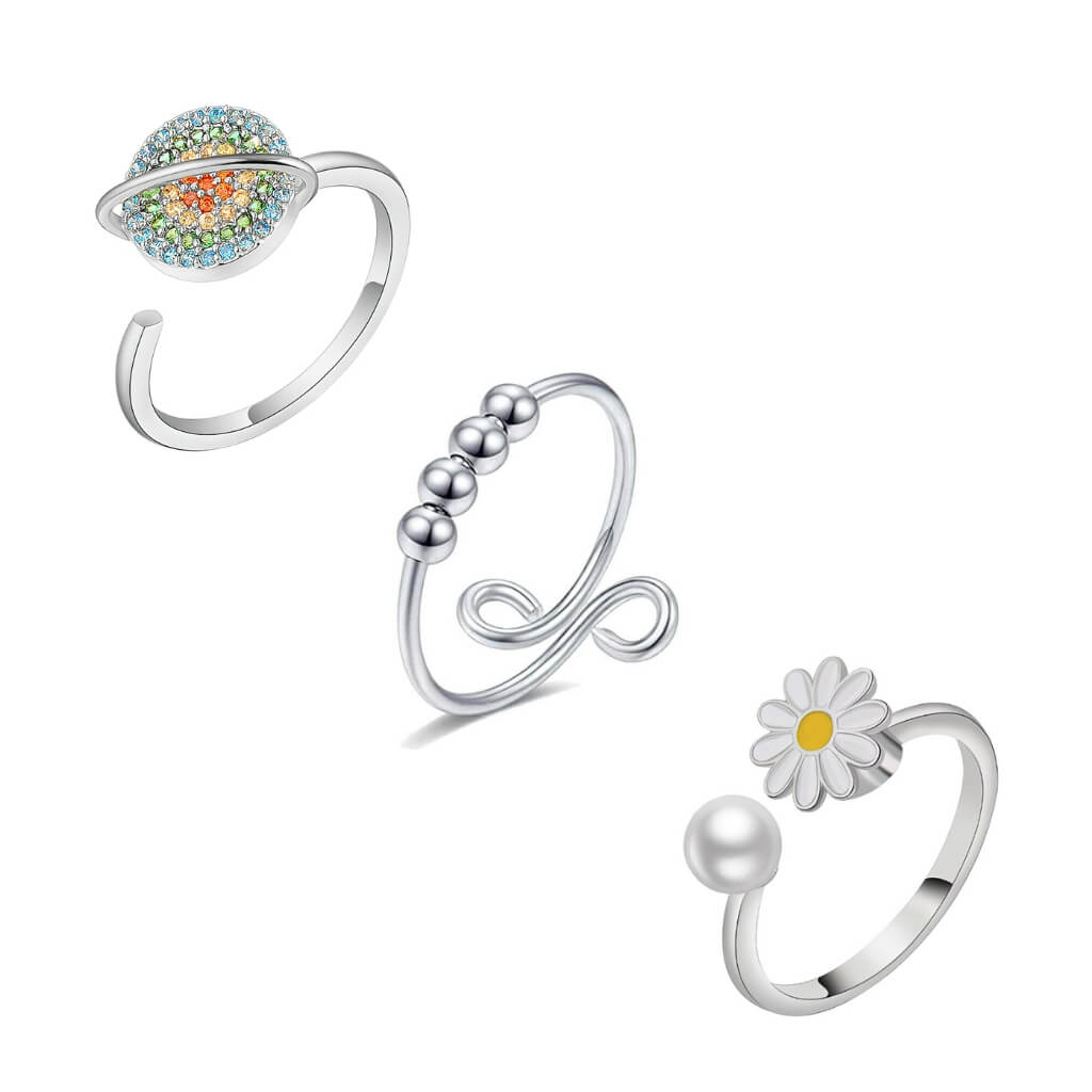 Soothing bundle of 3 sterling silver spinny rings on white background