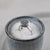 Sterling silver buddhist tibetan spinning ring in a bowl with salt