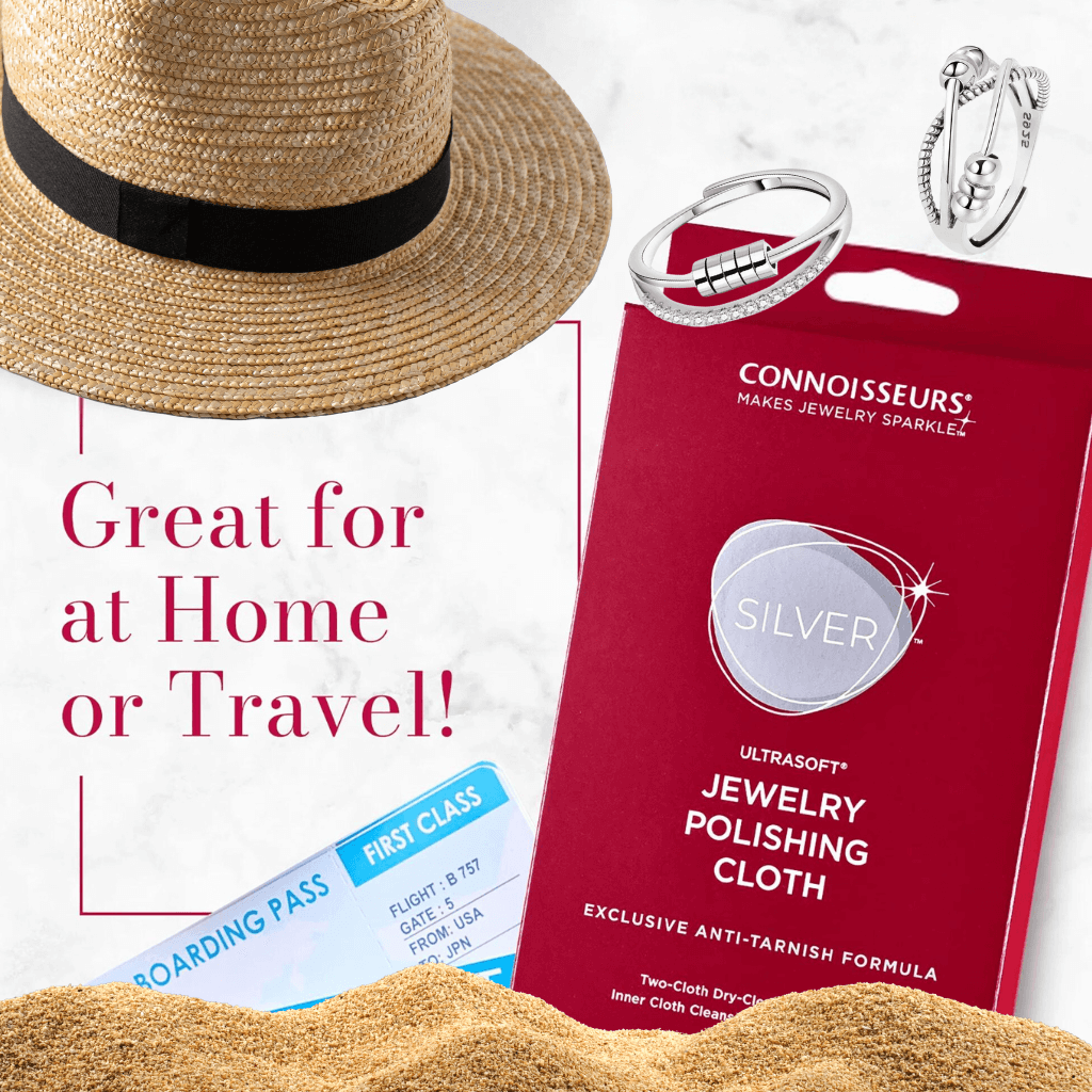 UltraSoft silver jewelry polishing cloth by Connoisseurs on sand next to a straw hat