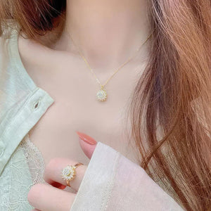 Woman with long hair and beige blouse wearing anxiety jewellery sunflower ring and necklace set
