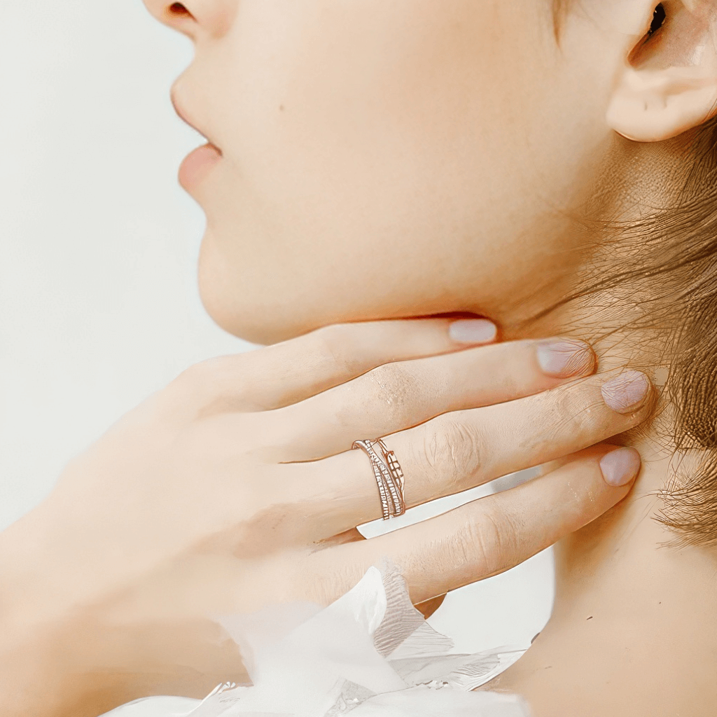 Woman touching her neck with a hand wearing a cubic zirconia cross over anxiety ring