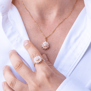 Woman in white shirt wearing fidget jewellery in Australia sunflower ring and necklace-set