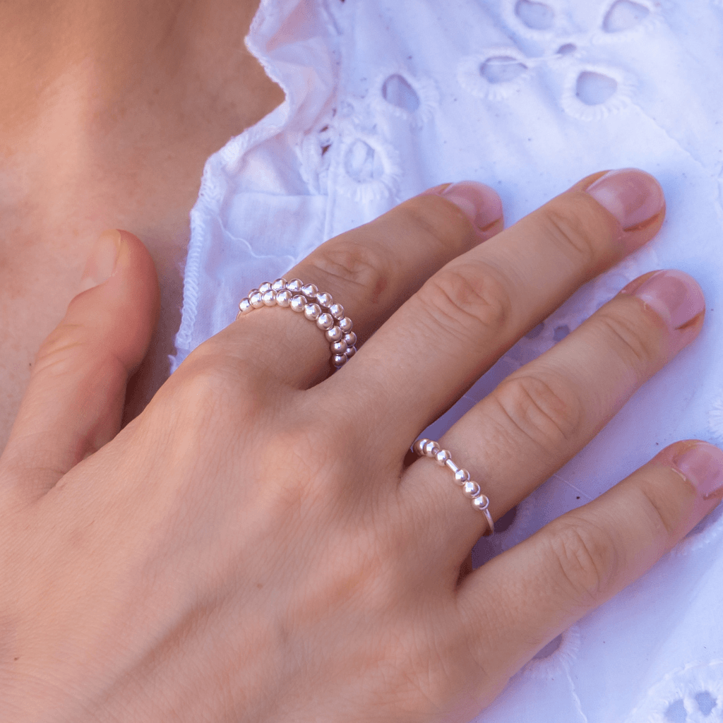 sterling silver beaded anxiety ring worn on hand showing fidget ring design