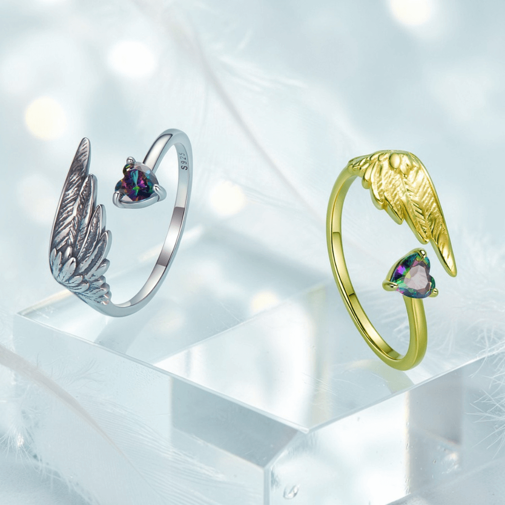 Silver and gold angel wing rings for women with heart shaped gemstones and adjustable open band design