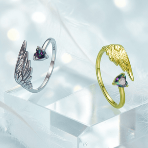 Silver and gold angel wing rings for women with heart shaped gemstones and adjustable open band design