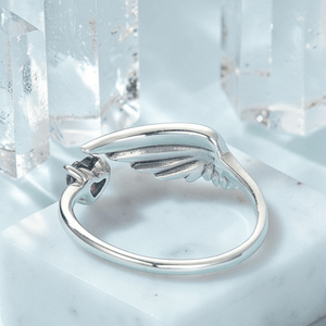 Silver angel wing jewelry ring back view showing adjustable open band and wing detail