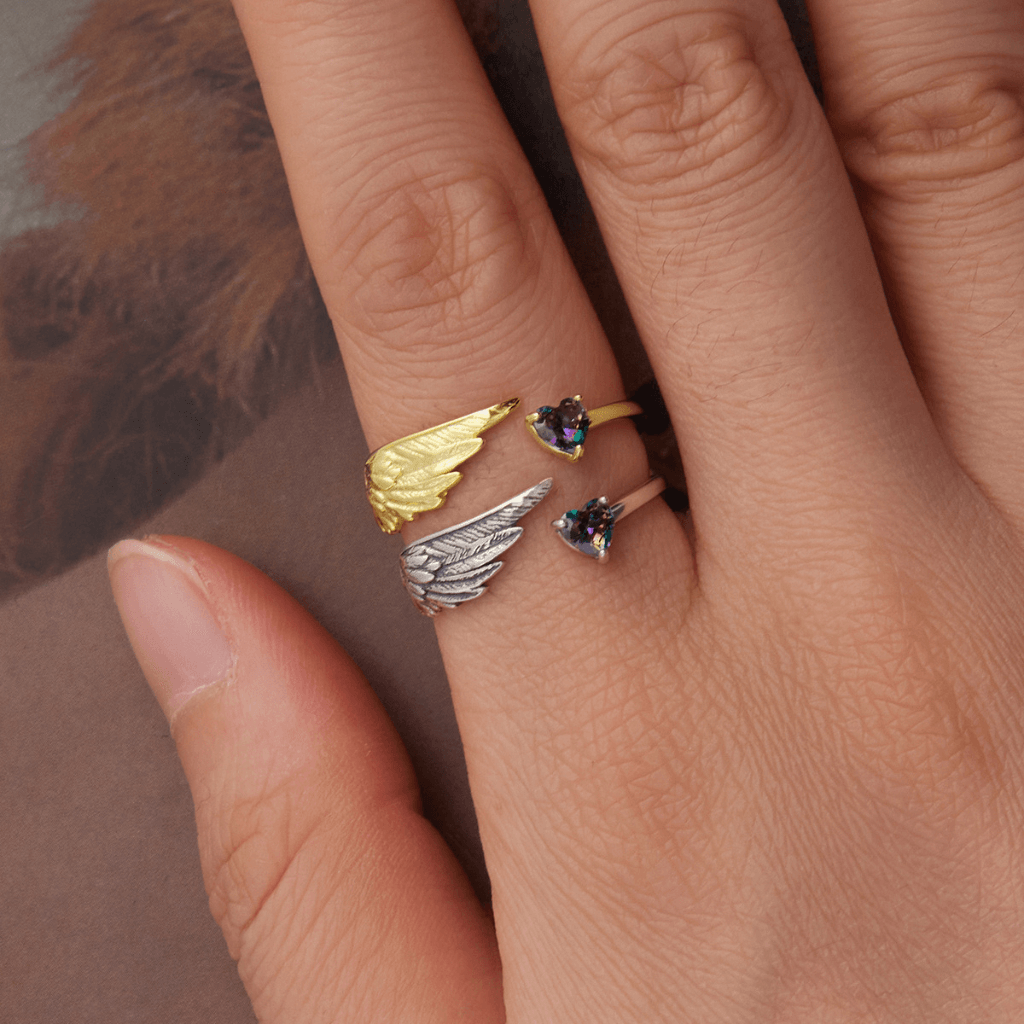 sterling silver and gold angel wing ring with heart shaped cubic zirconia