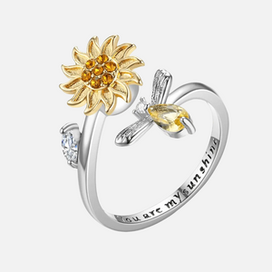Two-tone rhodium plated 925 silver and gold sunflower bee spinner fidget ring with you are my sunshine engraving on white background