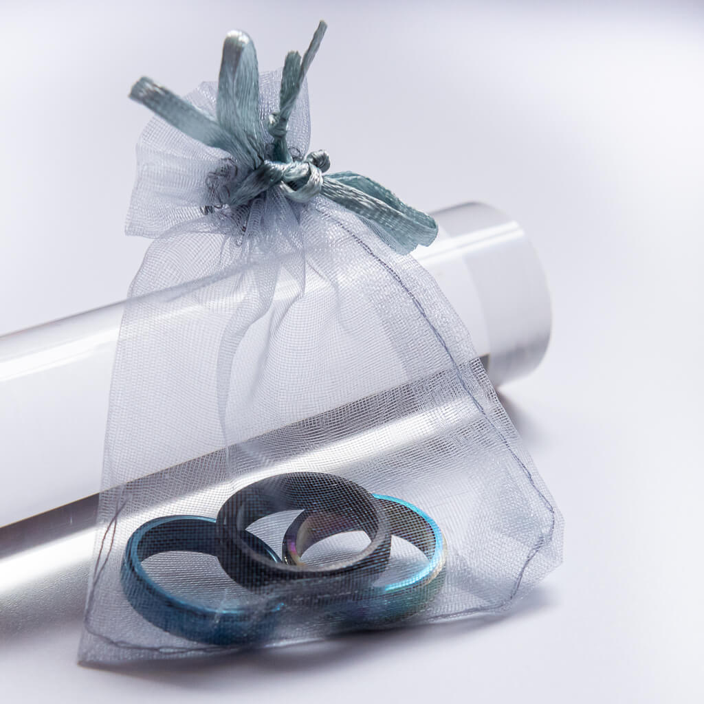 Anxiety rings Australia rainbow blue black in an organza pouch