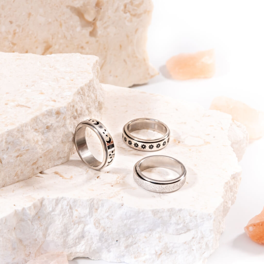 Calming classics bundle of 3 stainless steel band fidgeting rings on white background