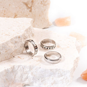 Calming classics bundle of 3 stainless steel band  rings for anxiety on a white stone