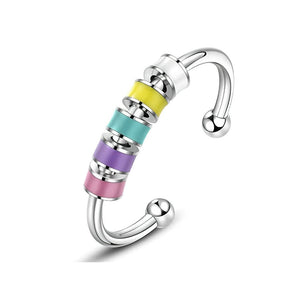 Colourful enamel  fidget ring with beads stainless steel on white background