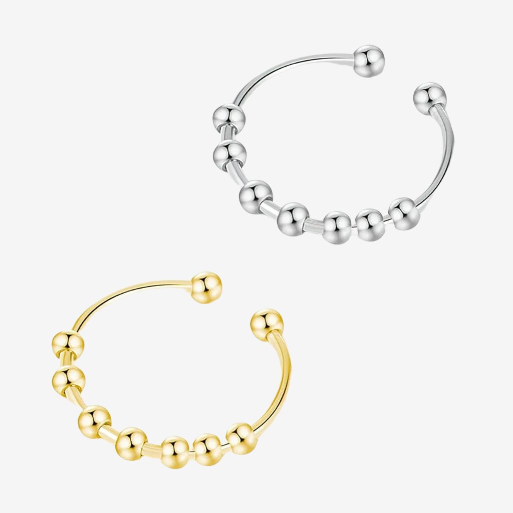 Gold and silver adjustable rings with beads  on white background