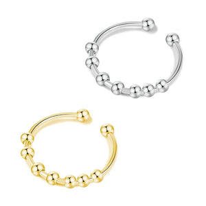 Gold and silver adjustable rings with beads  on white background