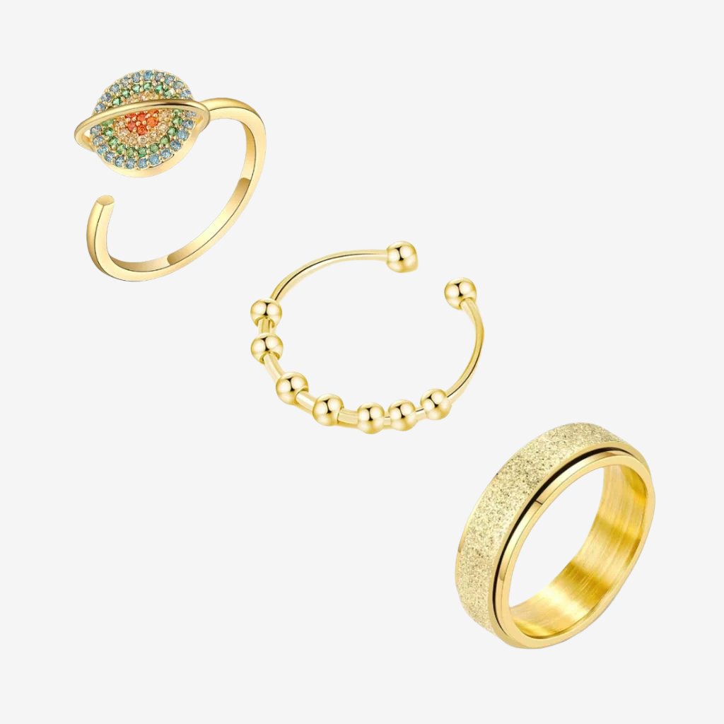 Grounding pack bundle of three spinner rings gold on white background