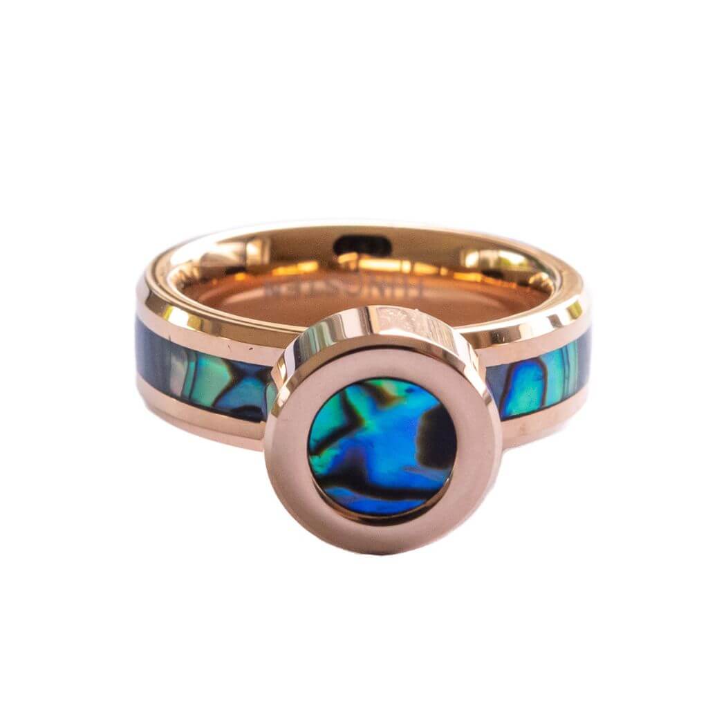 Shell ring in rose gold on white background