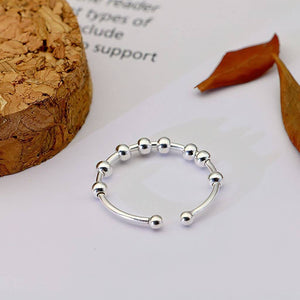 Silver ring with beads adjustable