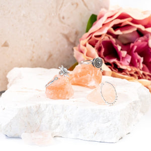 Sun ring, meditation ring and breaded ring on pink salt rocks close up