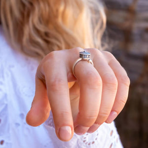 Woman in white shirt wearing a sterling silver Buddhist Tibetan spinning ring